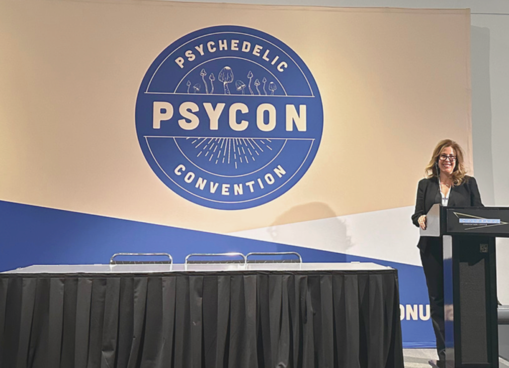 Jill on stage at psycon conference