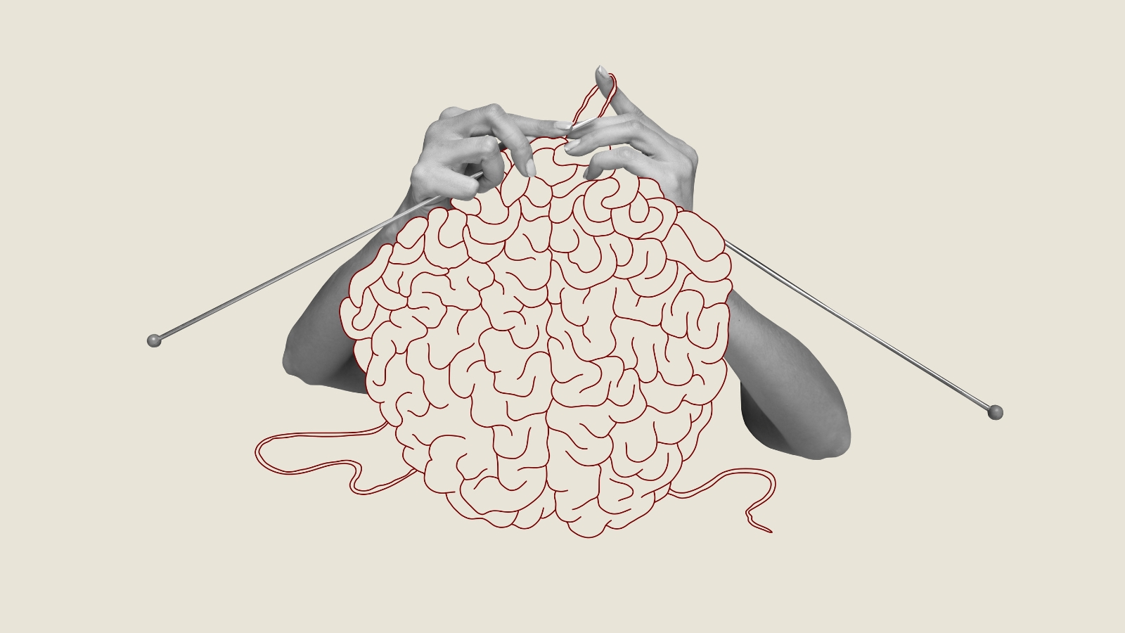 A picture of a brain made of yarn with someone knitting the yarn.